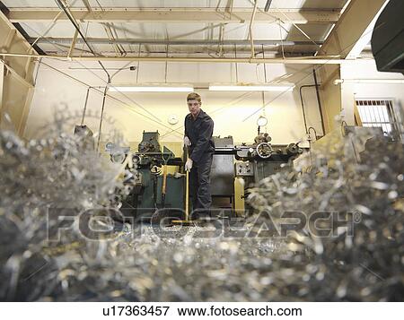 Apprentice Engineer Sweeping Swarf View Large Photo Image Stock Photo - Apprentice Engineer Sweeping Swarf. Fotosearch