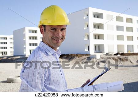 Stock Photo - Architect on construction site. Fotosearch