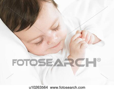 Picture - Baby girl sleeping. Fotosearch
