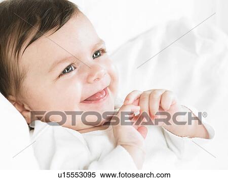 Stock Photography - Baby girl smiling. Fotosearch