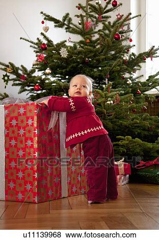 baby girl with big christmas present View Large Photo Image Stock Photo - baby girl with big christmas present. Fotosearch