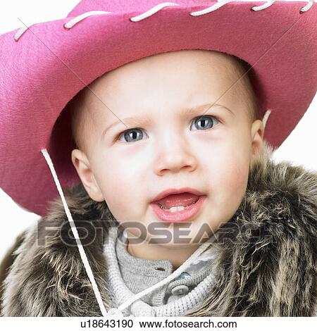 Baby girl with cowgirl hat on her head View Large Photo Image Stock Image - Baby girl with cowgirl hat on her head. Fotosearch