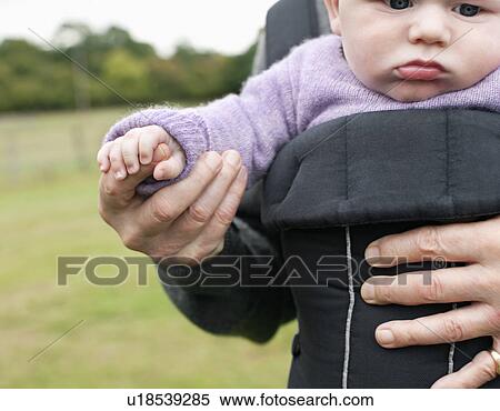 Baby holding grandfather's hand View Large Photo Image Stock Photography - Baby holding grandfather's hand. Fotosearch