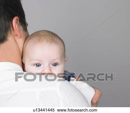 Baby on fathers shoulder View Large Photo Image Stock Photography - Baby on fathers shoulder. Fotosearch