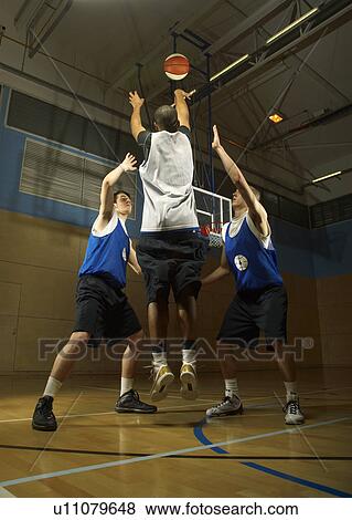 Basketball player shooting View Large Photo Image Stock Photo - Basketball player shooting. Fotosearch