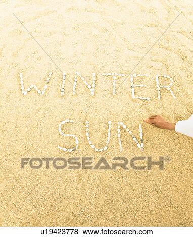 Stock Photo - Beach with pebble writing. Fotosearch