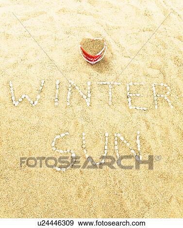 Stock Photo - Beach with pebble writing. Fotosearch