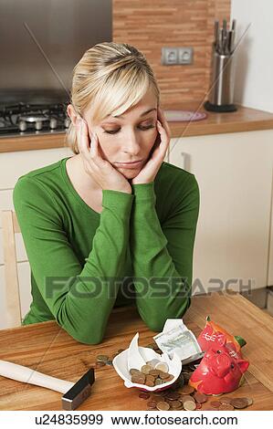 Beautiful woman and broken piggy bank View Large Photo Image Stock Photo - Beautiful woman and broken piggy bank. Fotosearch