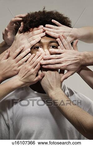 Stock Photograph - Black male hidden by hands. Fotosearch