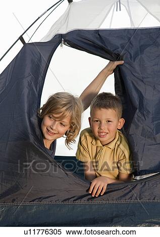 Boy and girl in tent by sea View Large Photo Image Stock Photography - Boy and girl in tent by sea. Fotosearch