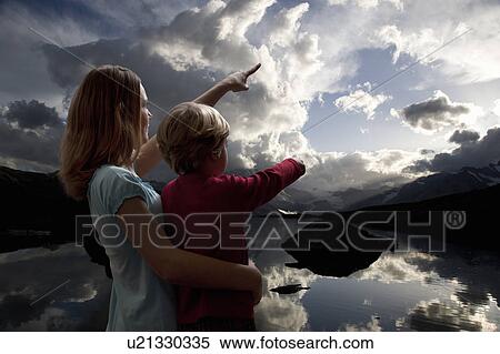 boy and girl watching the sky View Large Photo Image Stock Photography - boy and girl watching the sky. Fotosearch
