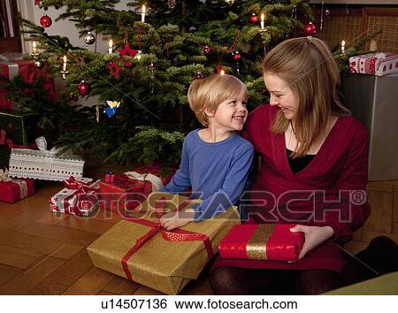 boy and girl with christmas presents View Large Photo Image Stock Photograph - boy and girl with christmas presents. Fotosearch