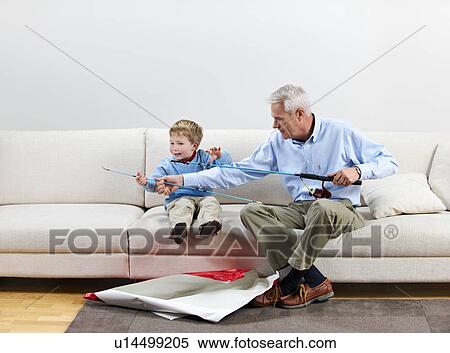 Boy and grandfather with new fishing rod View Large Photo Image Stock Photography - Boy and grandfather with new fishing rod. Fotosearch