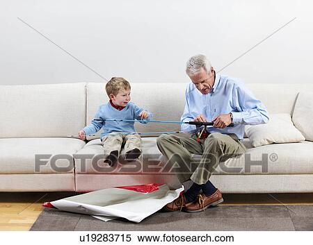 Boy and grandfather with new fishing rod View Large Photo Image Stock Photography - Boy and grandfather with new fishing rod. Fotosearch