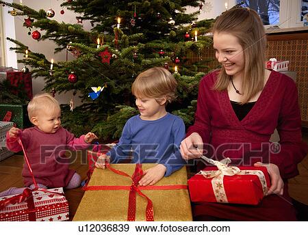 boy, baby, girl with christmas presents View Large Photo Image Stock Photo - boy, baby, girl with christmas presents. Fotosearch