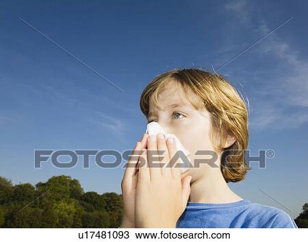 Boy blowing nose View Large Photo Image Stock Image - Boy blowing nose. Fotosearch