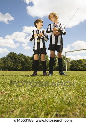Boy footballers with Trophies and medals View Large Photo Image Stock Photo - Boy footballers with Trophies and medals. Fotosearch