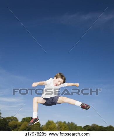 Boy Jumping in air View Large Photo Image Stock Photography - Boy Jumping in air. Fotosearch