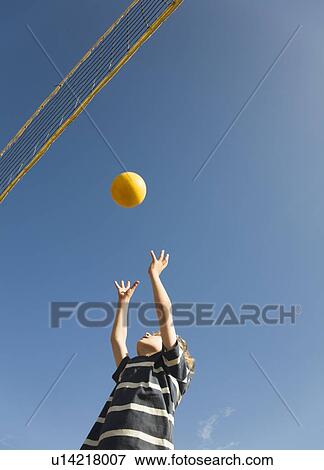 Boy playing volley ball View Large Photo Image Stock Photo - Boy playing volley ball. Fotosearch