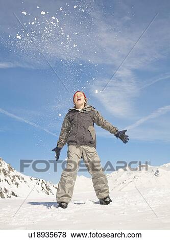 Boy throwing snow View Large Photo Image Stock Photo - Boy throwing snow. Fotosearch