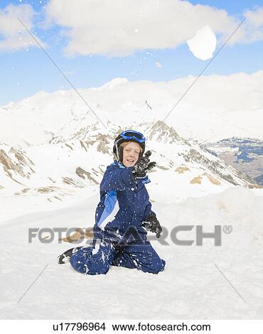 Boy throwing snowball View Large Photo Image Picture - Boy throwing snowball. Fotosearch
