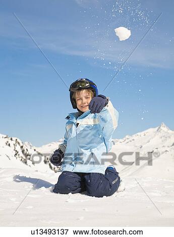 Boy throwing snowball View Large Photo Image Stock Photo - Boy throwing snowball. Fotosearch