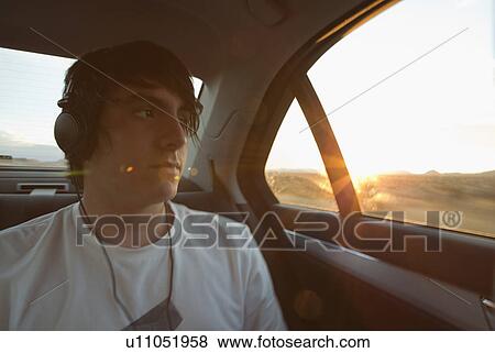 Stock Photo - Boy traveling in back seat of car. Fotosearch
