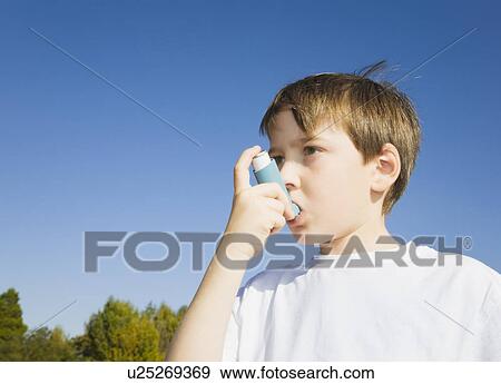Boy using Inhaler for asthma View Large Photo Image Stock Photo - Boy using Inhaler for asthma. Fotosearch