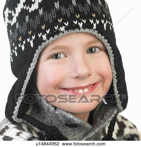 Stock Image - Boy wearing a winter hat. Fotosearch
