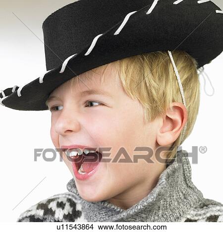 Boy with a cowboy hat, smiling View Large Photo Image Picture - Boy with a cowboy hat, smiling. Fotosearch