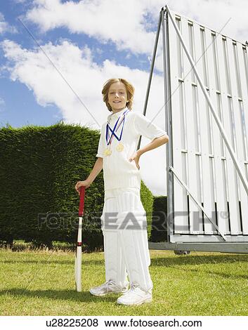 Boy with Cricket Bat and medals View Large Photo Image Stock Photo - Boy with Cricket Bat and medals. Fotosearch