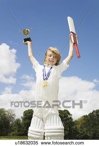 Boy with Cricket Bat, medals and Trophy View Large Photo Image Stock Photography - Boy with Cricket Bat, medals and Trophy. Fotosearch