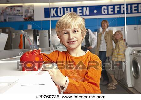 Boy with piggy bank View Large Photo Image Stock Photograph - Boy with piggy bank. Fotosearch
