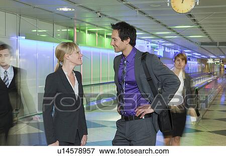 business couple at airport, talking View Large Photo Image Stock Photo - business couple at airport, talking. Fotosearch