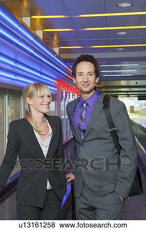 business couple on conveyor belt View Large Photo Image Stock Photo - business couple on conveyor belt. Fotosearch