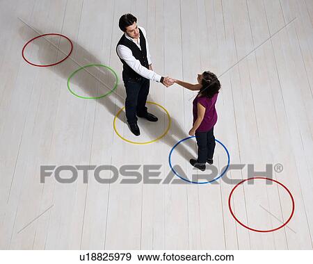 Business man and woman shaking hands View Large Photo Image Stock Photo - Business man and woman shaking hands. Fotosearch