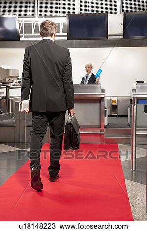 Business man going to airport checkin View Large Photo Image Stock Image - Business man going to airport checkin. Fotosearch