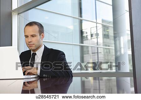 Business man is working with laptop View Large Photo Image Stock Image - Business man is working with laptop. Fotosearch