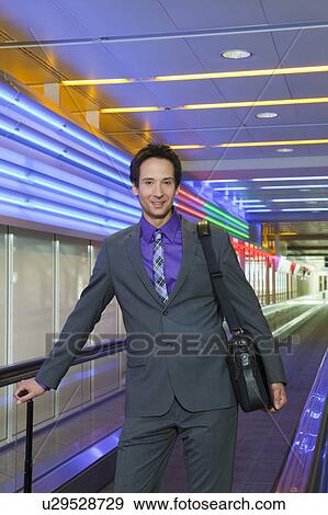 business man on conveyor belt, happy View Large Photo Image Stock Photo - business man on conveyor belt, happy. Fotosearch