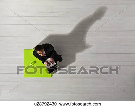 Business man on laptop View Large Photo Image Stock Image - Business man on laptop. Fotosearch