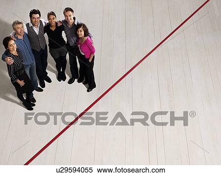 Business men and women by red line View Large Photo Image Stock Photography - Business men and women by red line. Fotosearch