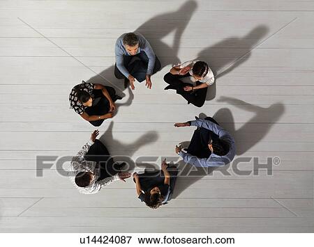 Business men and women sitting in circle View Large Photo Image Stock Photo - Business men and women sitting in circle. Fotosearch