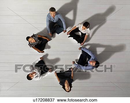 Business men and women sitting in circle View Large Photo Image Stock Photo - Business men and women sitting in circle. Fotosearch