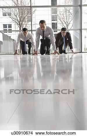 Picture - Business men at start position waiting. Fotosearch