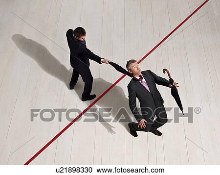 Business men fighting with umbrellas View Large Photo Image Stock Image - Business men fighting with umbrellas. Fotosearch