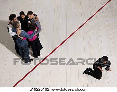 Stock Image - Business people divided by red line. Fotosearch