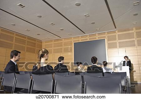 Stock Image - Business people in seminar. Fotosearch