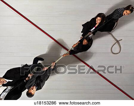 Business people pulling each other View Large Photo Image Stock Photograph - Business people pulling each other. Fotosearch
