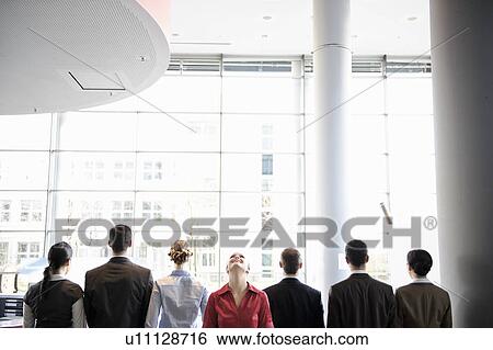 Stock Photograph - Business people standing in line. Fotosearch