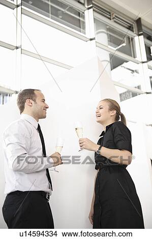 Business team toasting champagne glasses View Large Photo Image Picture - Business team toasting champagne glasses. Fotosearch